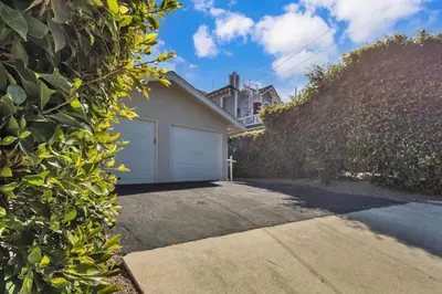 a driveway with a garage in front of a house at Comfortable Carlsbad 2BR Beach Home Walk to Beach in Carlsbad