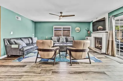 a living room with a couch and a table and chairs at Stunning 4BR Laguna Hills Oasis with Private Pool in Laguna Hills