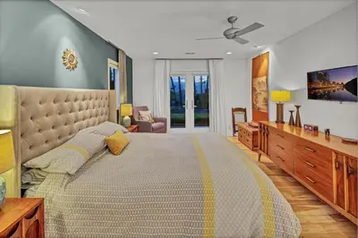 a large bedroom with a large bed and a couch at Encinitas Beach Family Retreat with Hot Tub in Encinitas