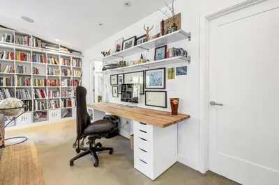 a home office with a desk and book shelves at Encinitas Beach Family Retreat with Hot Tub in Encinitas