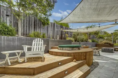 a patio with a table and chairs and a pool table at Encinitas Beach Family Retreat with Hot Tub in Encinitas
