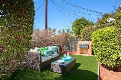 a garden with a couch and a table in the grass at Old Town 1BR Short Drive to Downtown and Beaches 84 in San Diego