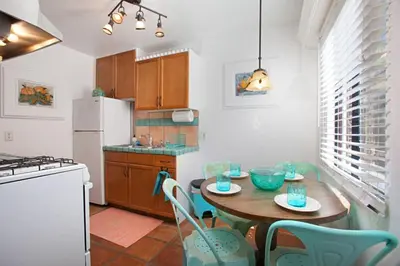 a kitchen with a table and chairs and a refrigerator at Old Town 1BR Short Drive to Downtown and Beaches 84 in San Diego