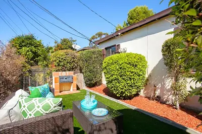 a small garden with a couch and a table at Old Town 1BR Short Drive to Downtown and Beaches 84 in San Diego