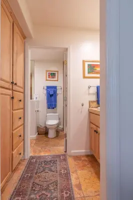 a bathroom with a toilet and a sink at Oceanfront Condo on Sand, Walk to Carlsbad Village in Carlsbad