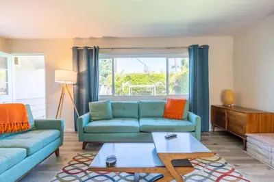 a living room with a couch and a table at Staycation Beach Family Home Great Indoor Outdoor in Carlsbad