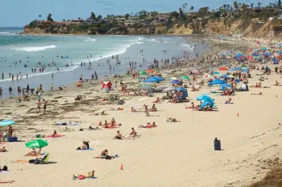 a large group of people on a beach at Pacific Beach Cottage 3 Walk to the Beach and Bay in San Diego