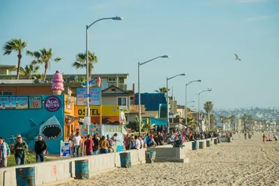 a crowd of people standing on a beach at Pacific Beach Cottage 3 Walk to the Beach and Bay in San Diego