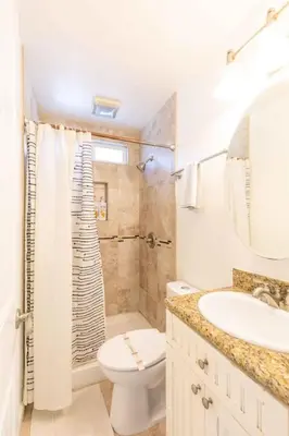 a bathroom with a toilet sink and a shower at Pacific Beach Cottage 4 Walk to the Beach and Bay in San Diego