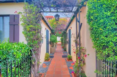 an alley in an old town with flowers at Old Town 1BR Short Drive to Downtown and Beaches 2.5 in San Diego