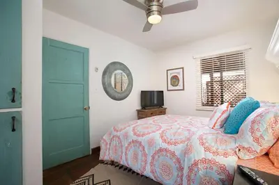 a bedroom with a bed and a blue door at Old Town 1BR Short Drive to Downtown and Beaches 2.5 in San Diego