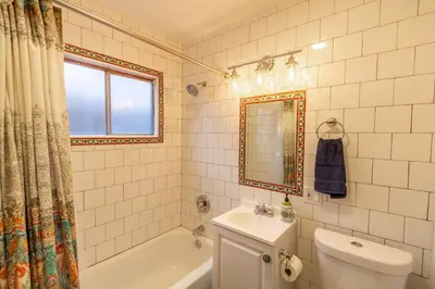 a bathroom with a toilet and a tub and a sink at Old Town 1BR Short Drive to Downtown and Beaches 2.5 in San Diego