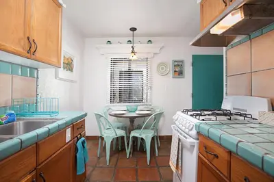 a kitchen with a table and a sink and a stove at Old Town 1BR Short Drive to Downtown and Beaches 2.5 in San Diego