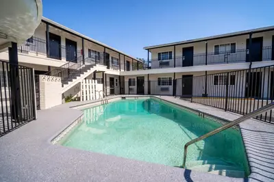 a swimming pool in front of a building at ERTH INN by AGA- San Ysidro in San Diego