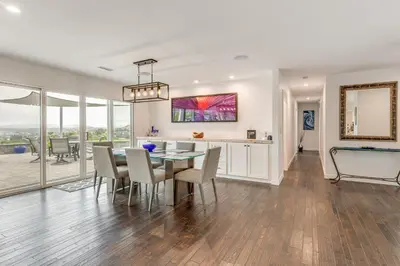 a dining room and kitchen with a table and chairs at 2 Mi to Lake Poway Mtn-View Escape with Patio! in Poway