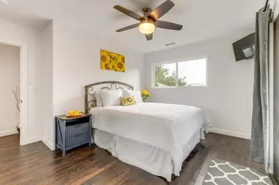 a bedroom with a bed and a ceiling fan at 2 Mi to Lake Poway Mtn-View Escape with Patio! in Poway