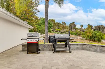 a grill and a barbecue on a patio at 2 Mi to Lake Poway Mtn-View Escape with Patio! in Poway