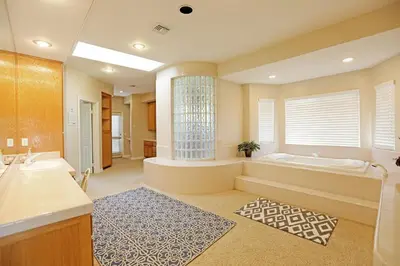 a large bathroom with a tub and a sink at Lakeside Mansion Waterfront 34 beds Boat ramp in Lake Elsinore