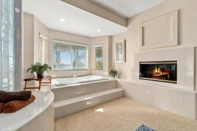a large bathroom with a tub and a fireplace at Lakeside Mansion Waterfront 34 beds Boat ramp in Lake Elsinore
