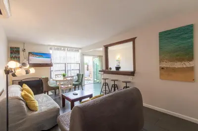 a living room with a couch and a table at Ocean Beach Bungalow Separate Entry in San Diego