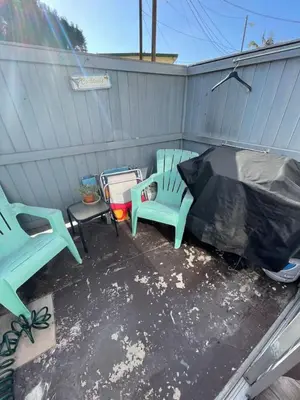 two chairs and a table on a patio at Cozy Ocean Beach Cottage Separate Entry in San Diego