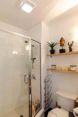 a bathroom with a shower and a toilet at Modern Loft, Quiet, WiFi, Cable, Parking in San Diego