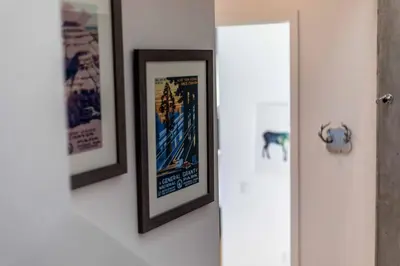 two framed pictures hanging on a wall at Modern Loft, Quiet, WiFi, Cable, Parking in San Diego