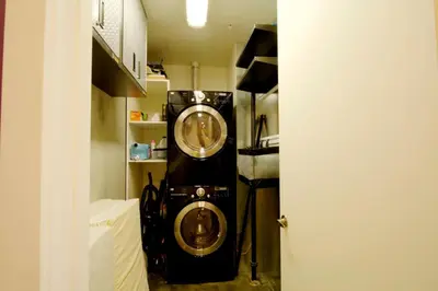 a washer and dryer in a small room at Modern Loft, Quiet, WiFi, Cable, Parking in San Diego