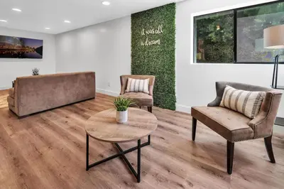 a living room with two chairs and a table at Upscale 4BR Retreat near Monserate Winery Pool Spa in Fallbrook