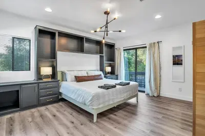 a bedroom with a large bed and a large window at Upscale 4BR Retreat near Monserate Winery Pool Spa in Fallbrook