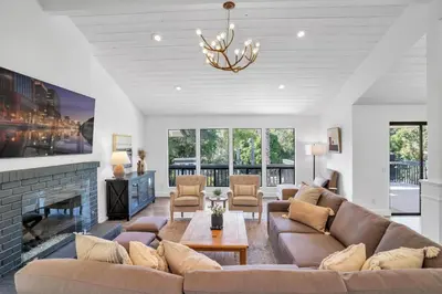 a living room with a couch and a fireplace at Upscale 4BR Retreat near Monserate Winery Pool Spa in Fallbrook