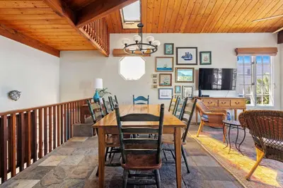 a dining room with a wooden table and chairs at The Whalen House - Steps from the Ocean in San Diego