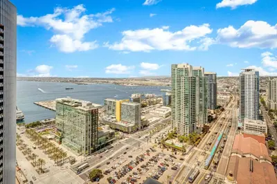 an aerial view of a city with tall buildings at Panoramic Bay and City Views - 2BR, Pool, Gym, Parking in San Diego