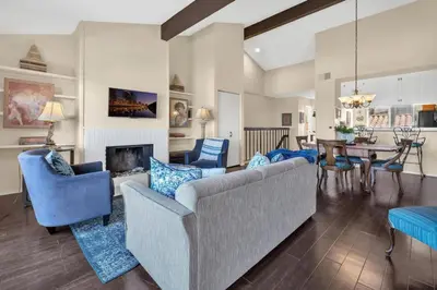 a living room with a couch and chairs and a table at 2BR Condo with Views Near Shops and Food, Fast WiFi in Carlsbad