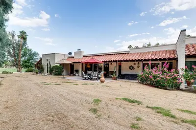 an empty dirt road in front of a house at 2 Mi to Galleta Meadows Desert Golf Retreat! in Borrego Springs