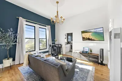 a living room with a couch and a table at Victorian Gem Close to Petco Park & Gaslamp in San Diego