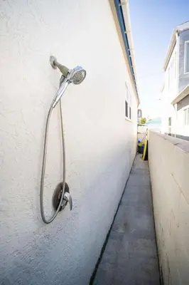 a shower on the side of a building at Steps from the Sand Mission Beach House in San Diego