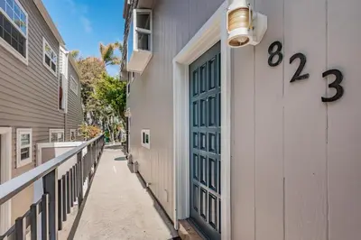 a door on the side of a building with numbers on it at Seaside Retreat in San Diego