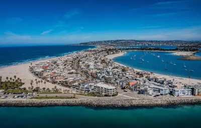 an aerial view of a beach with condos and the ocean at Ocean Vista Penthouse 2 in San Diego