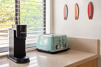 a toaster sitting on a counter next to a window at La Jolla Hillside Views and Coastal Comfort in San Diego