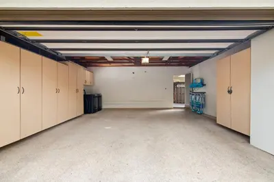 an empty garage with lots of cabinets and a large room at La Jolla Hillside Views and Coastal Comfort in San Diego
