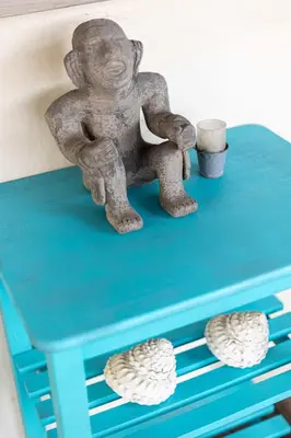 a statue of a man sitting on a blue table at Steps to Ocean Sunset Views Beach Access & San Diego Charm in San Diego