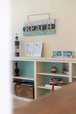 a white shelf with a welcome sign on it at Steps to Ocean Sunset Views Beach Access & San Diego Charm in San Diego