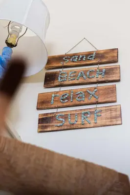 a group of wooden signs hanging on a wall at Steps to Ocean Sunset Views Beach Access & San Diego Charm in San Diego