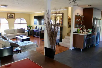 a living room with a couch and a table at Room in Bay Park, San Diego in San Diego