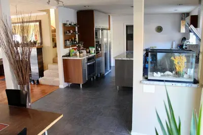 a living room with a fish tank on the wall at Room in Bay Park, San Diego in San Diego
