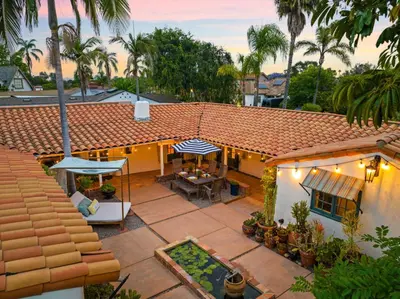 an aerial view of a house with a patio at Spacious Spanish Hacienda Close to Everything in San Diego