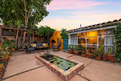 a backyard with a garden with a water feature at Spacious Spanish Hacienda Close to Everything in San Diego