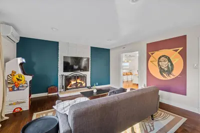 a living room with a couch and a fireplace at Spacious House close to Petco Park and Gaslamp in San Diego