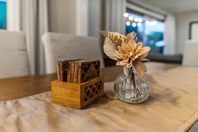 a vase with flowers in it sitting on a table at Spacious House close to Petco Park and Gaslamp in San Diego